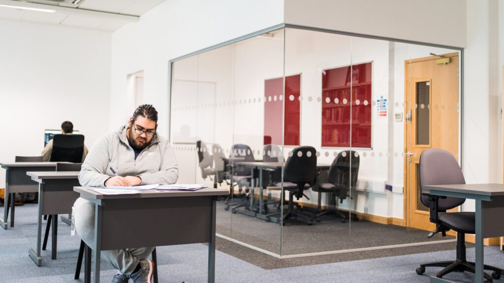 Student sitting in the Independent learning zones of Leeds Sixth Form College