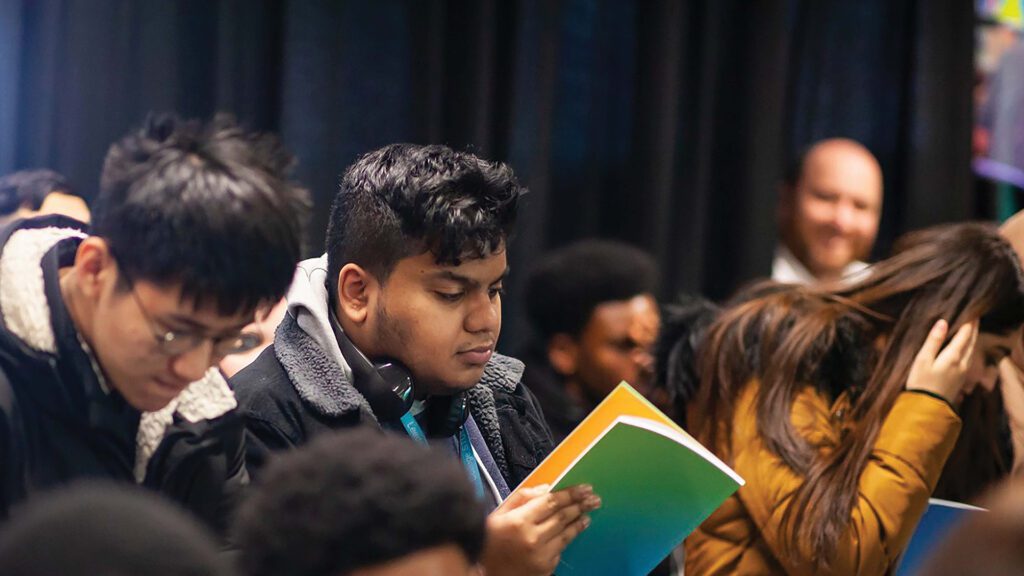 Students learning in an open plan auditorium and lecture theatre