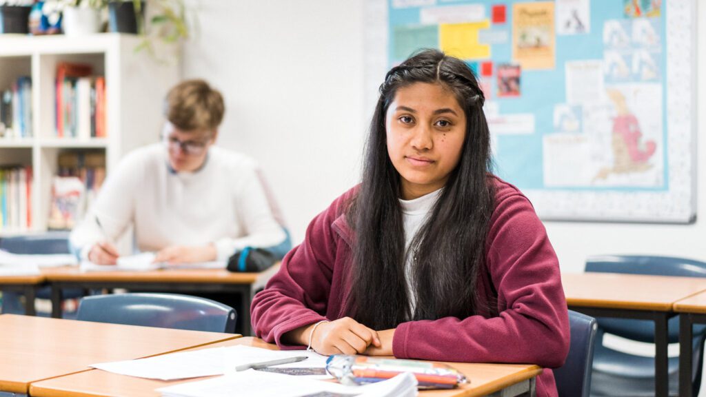2 students sitting at their tables studying