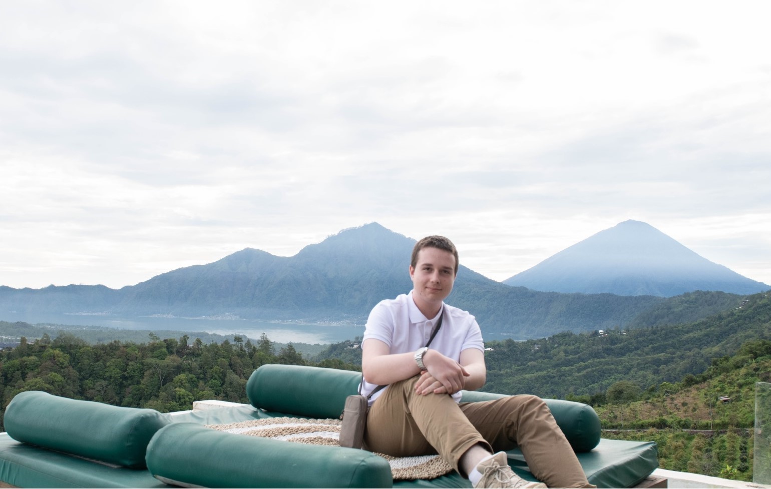 Leeds Sixth Form College A levels student Simon O'Connor sitting with a backdrop of mountains during his trip to Bali